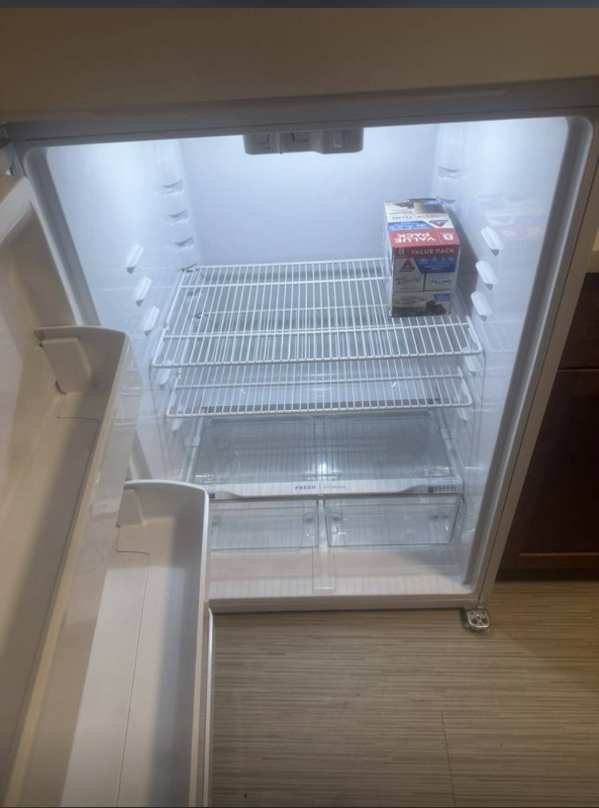 Spotless empty refrigerator interior after deep cleaning and sanitizing