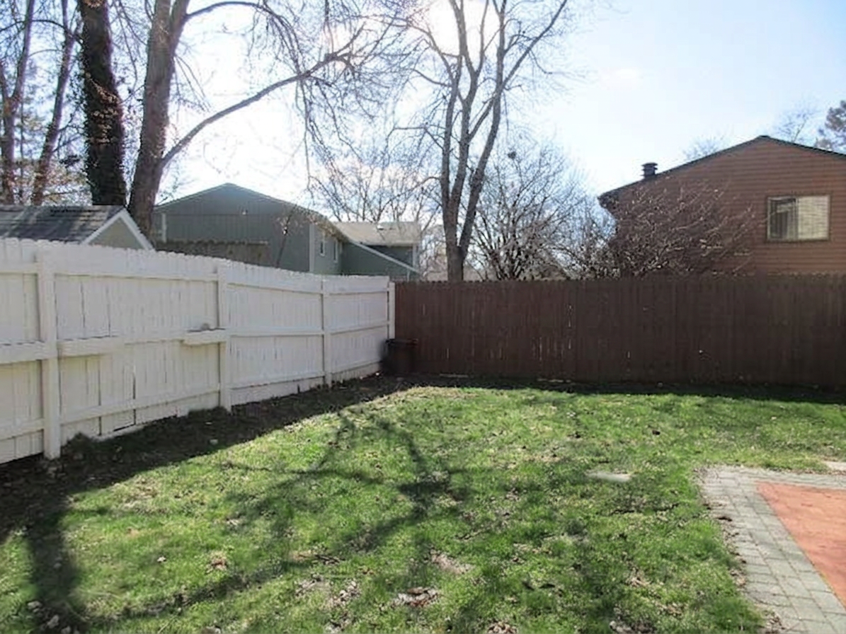 Clean empty backyard after lumber and debris removal