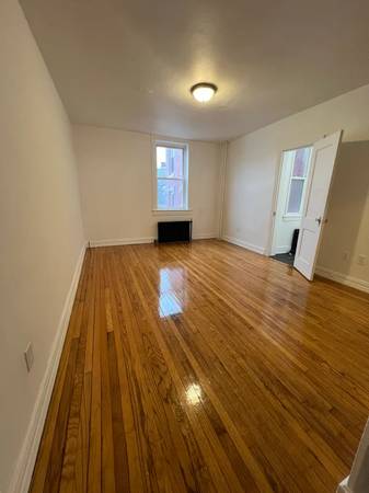 Bright room with gleaming hardwood floors