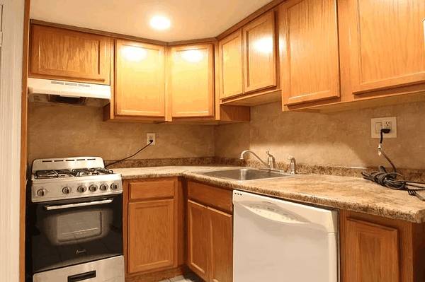 Warm-toned kitchen cleaned top to bottom